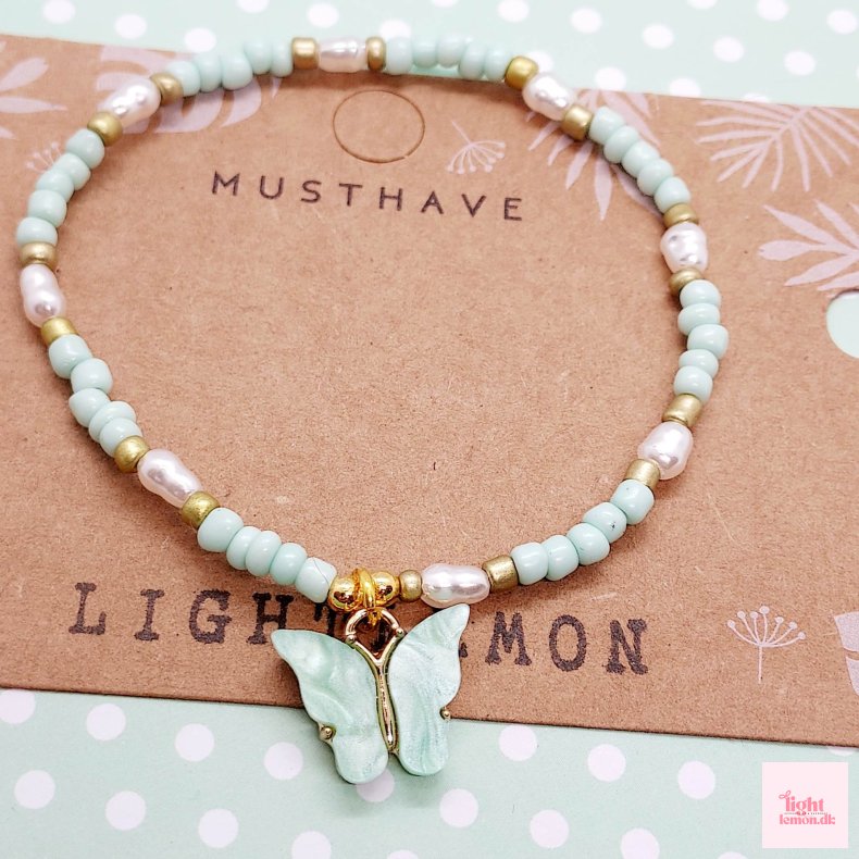 Armb�nd med sommerfugl. Lysegr�n