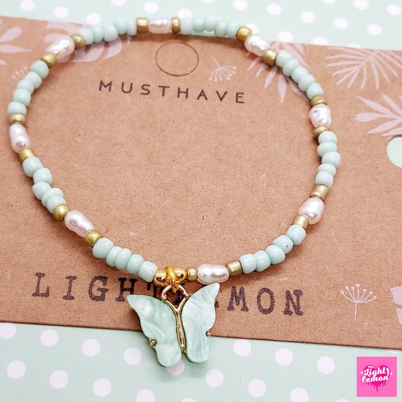 Armbnd med sommerfugl. Lysegrn