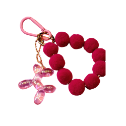 N�glering med pom pom. Magenta