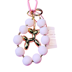 N�glering med pom pom. Lyser�d